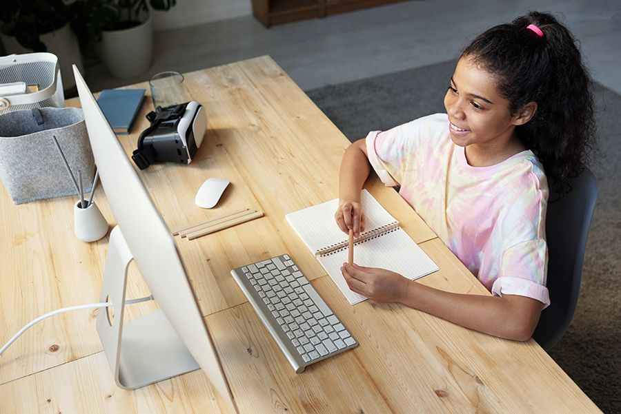 Young girl on computer during remote learning